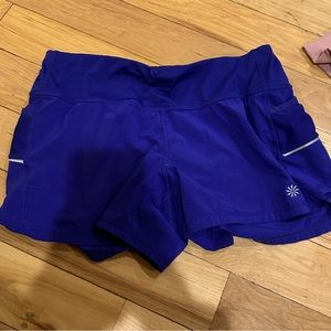 Athletic dark blue shorts.